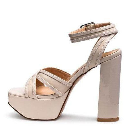 Stylish Nyle heeled sandals with a chunky heel and crisscross straps for a modern look