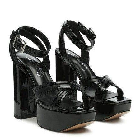 Stylish Nyle heeled sandals in black with a chunky platform and ankle strap for women