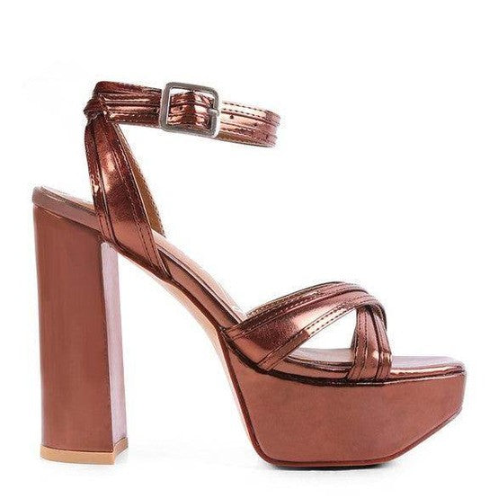 Nyle heeled sandals in shiny rose gold with a thick heel and ankle strap for stylish elegance