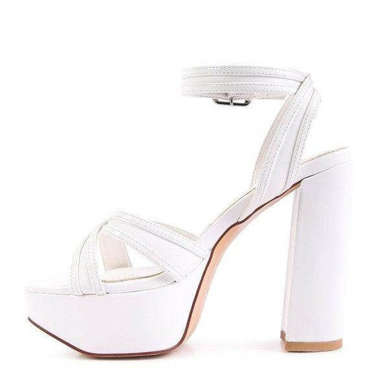 White Nyle heeled sandals with a chunky platform and ankle strap design for stylish elevation