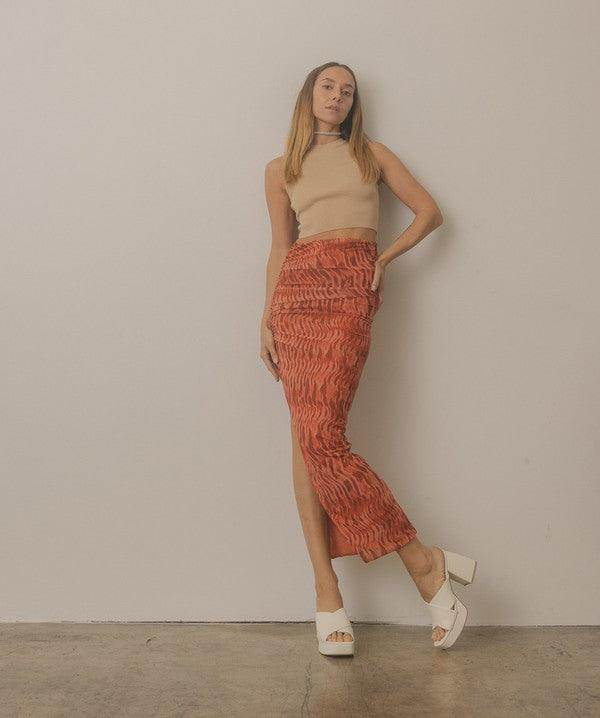 Oasis Society platform mule sandals in white paired with a stylish skirt for a trendy look