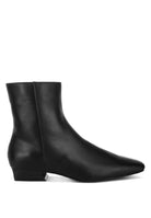 Sleek black Obita leather boots for vacation with a pointed toe and low heel for stylish comfort