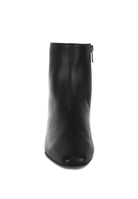 Front view of Obita leather boots for vacation with a sleek black design and side zipper