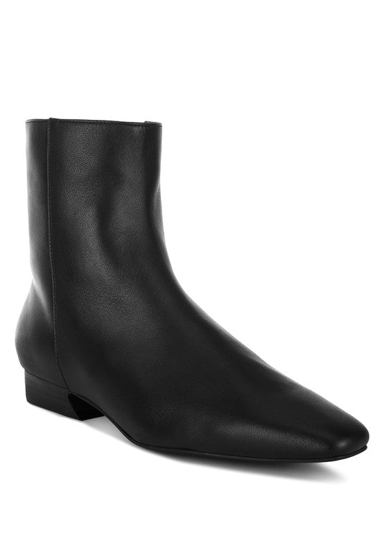 Stylish black Obita leather boots for vacation with a pointed toe design