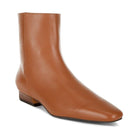 Rag Company Obita leather boots for vacation in tan with a sleek design and low heel.