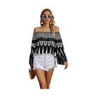 Stylish women's off shoulder graphic print top paired with white shorts for a trendy summer look