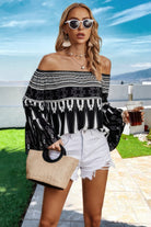 Stylish off shoulder graphic print top for women paired with shorts and sunglasses, ideal for summer outings