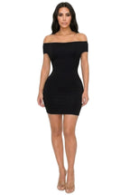 Women's black off shoulder mini dress, perfect for clubwear or night outings
