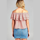 Back view of Women's off shoulder polka dot top by Ivory Felix with ruffle detail