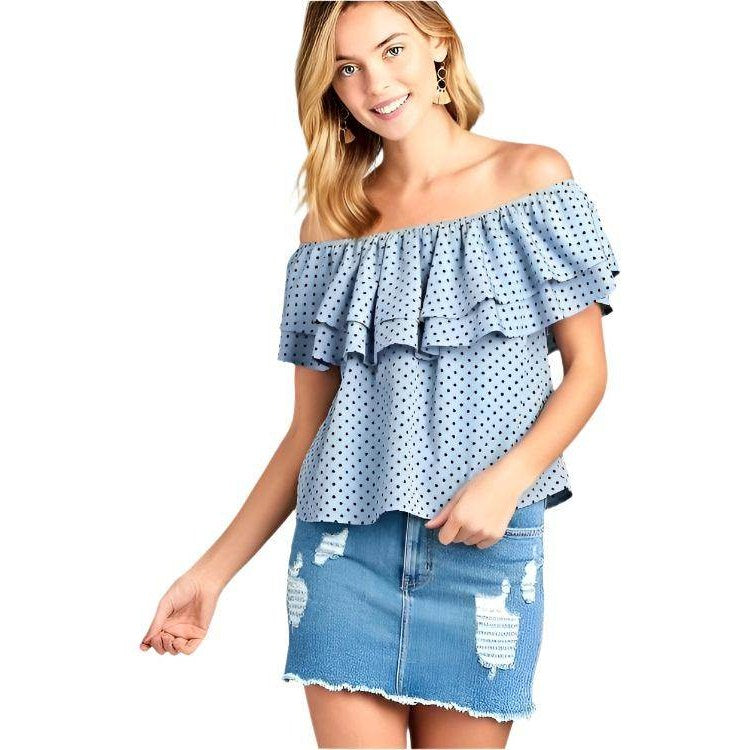 Ivory Felix off shoulder polka dot top in blue with ruffle design and paired with a distressed denim skirt