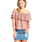 Ivory Felix off shoulder polka dot top in pink with ruffled sleeves and paired with a denim skirt