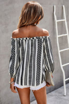 Back view of a woman's off shoulder striped blouse with black and white patterns, perfect for summer outings