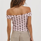 Women's pink polka dot off the shoulder top, perfect for casual outings