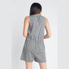 Back view of olive sleeveless romper by Ivory Felix with adjustable waistband for a comfortable fit