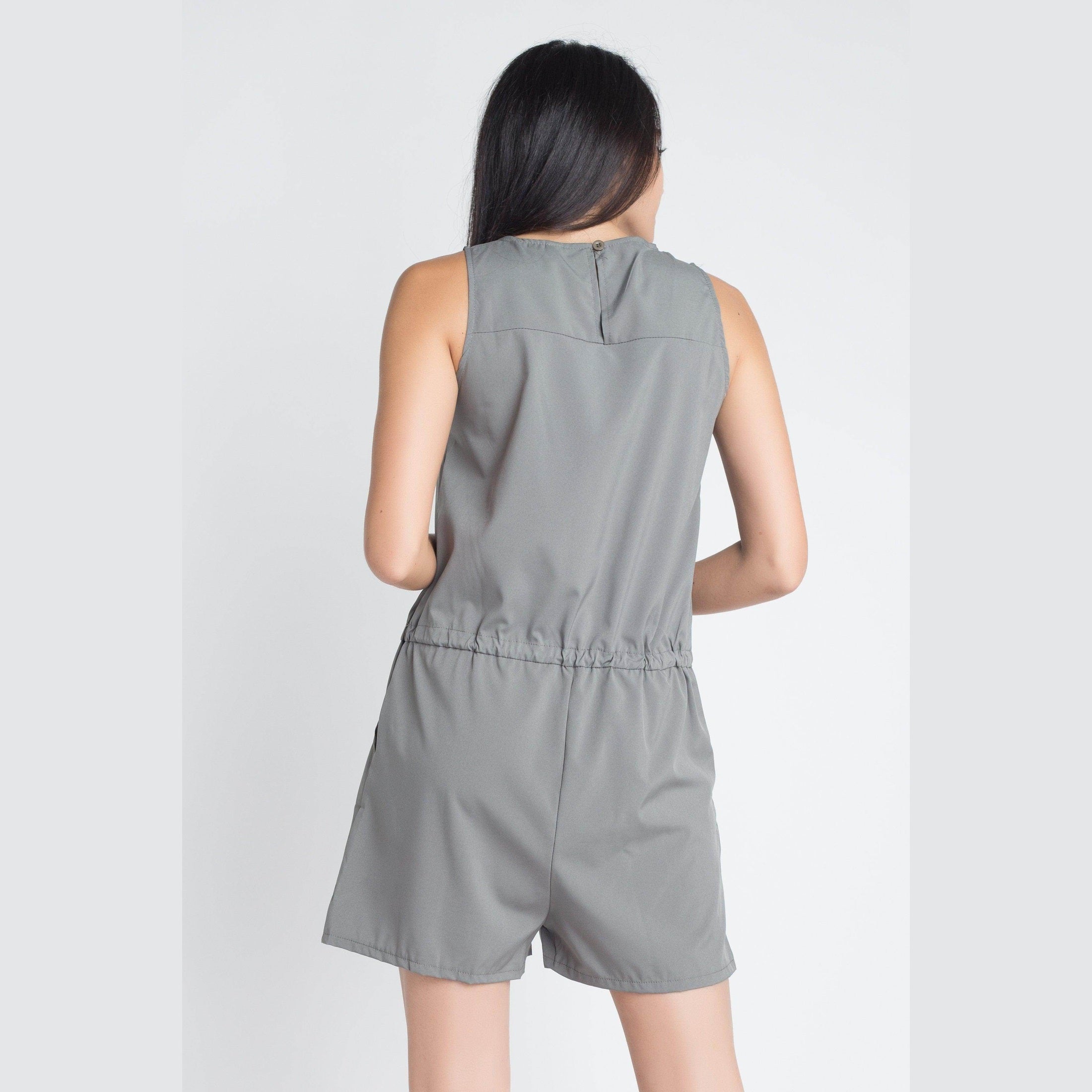 Back view of olive sleeveless romper by Ivory Felix with adjustable waistband for a comfortable fit