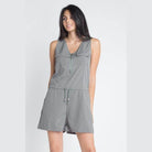 Olive sleeveless romper by Ivory Felix with a zip front and adjustable drawstring waist