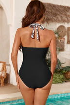 Women's black one piece halter top swimsuit, perfect for beach outings