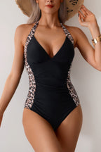 Women's black one piece halter top swimsuit with leopard print sides