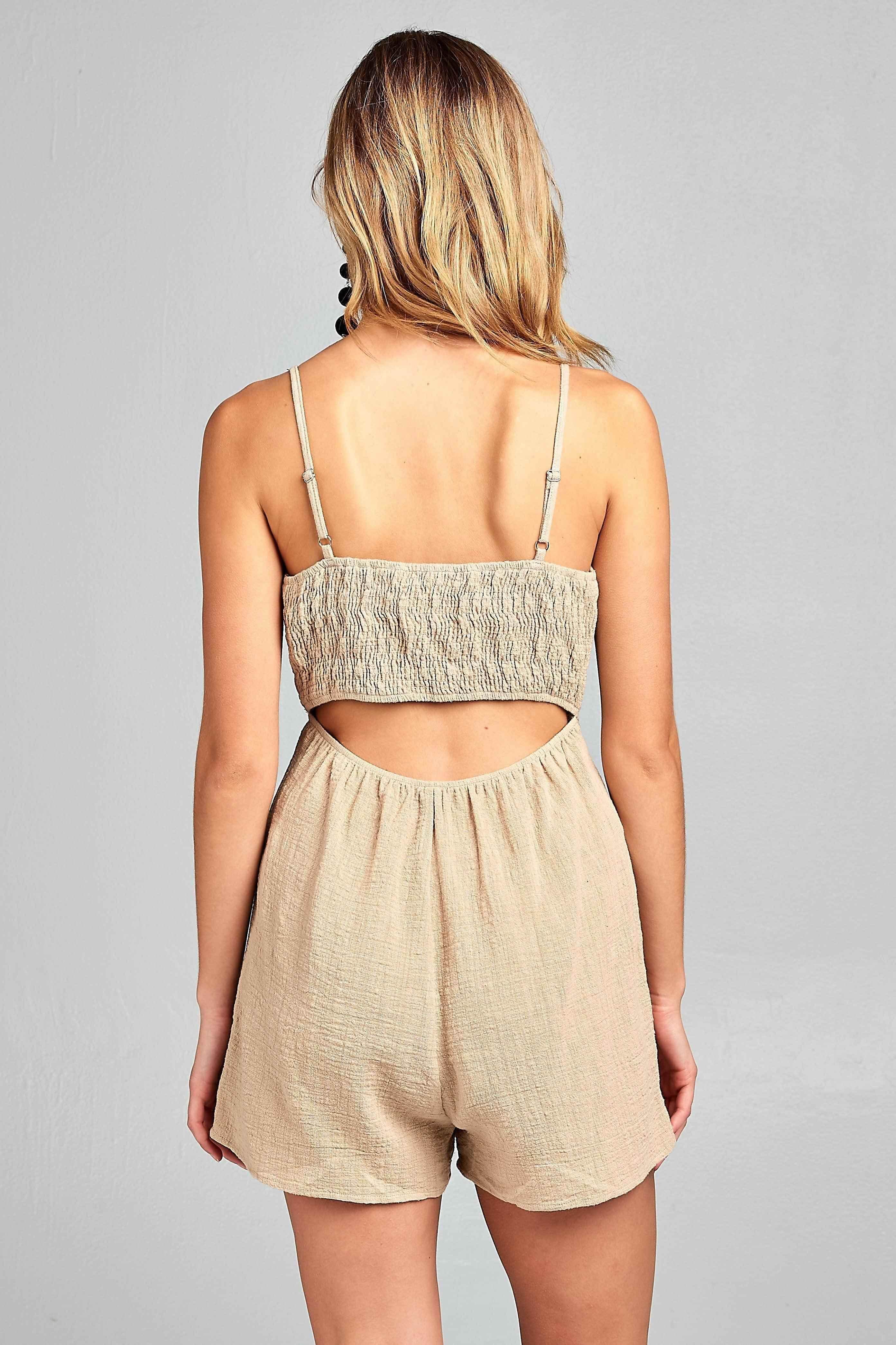 Back view of a Women's one-piece romper with open back in beige by Ivory Felix