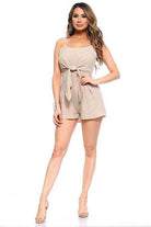 Ivory Felix one-piece romper with open back featuring a stylish tied waist and relaxed fit