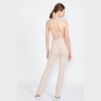 Emory Park open back jumpsuit vacation in beige with a stylish halter neck design for summer outings
