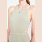 Emory Park open back jumpsuit vacation in soft green ribbed fabric, perfect for stylish summer outings