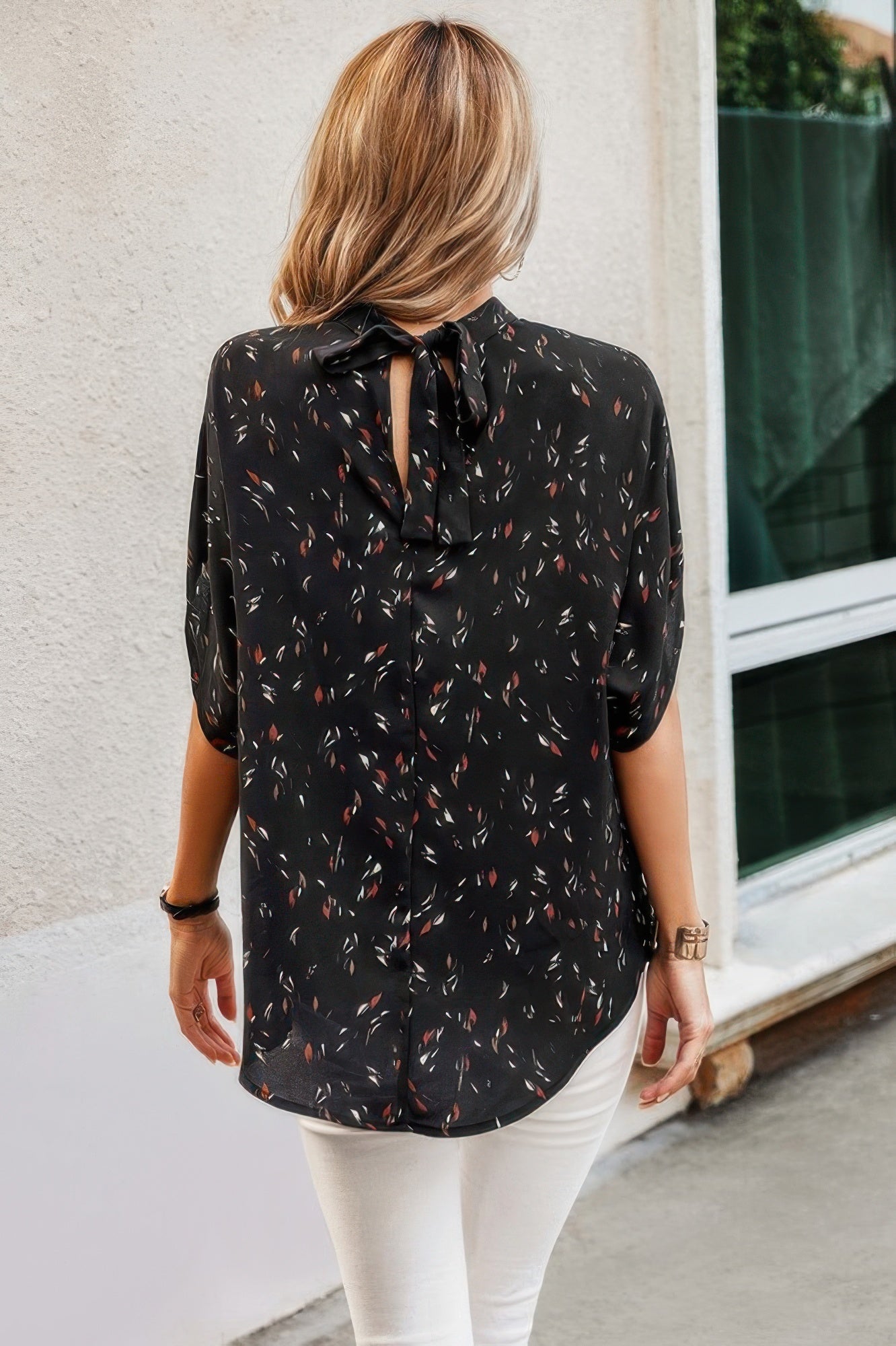 VacationGrabs open back summer tops for women in black with colorful floral pattern and elegant tie detail