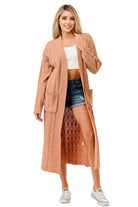 Women's open front cable knit sweater in soft peach color with pockets and long sleeves