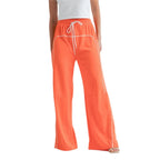 Women's orange drawstring pants with white piping and wide legs by VacationGrabs
