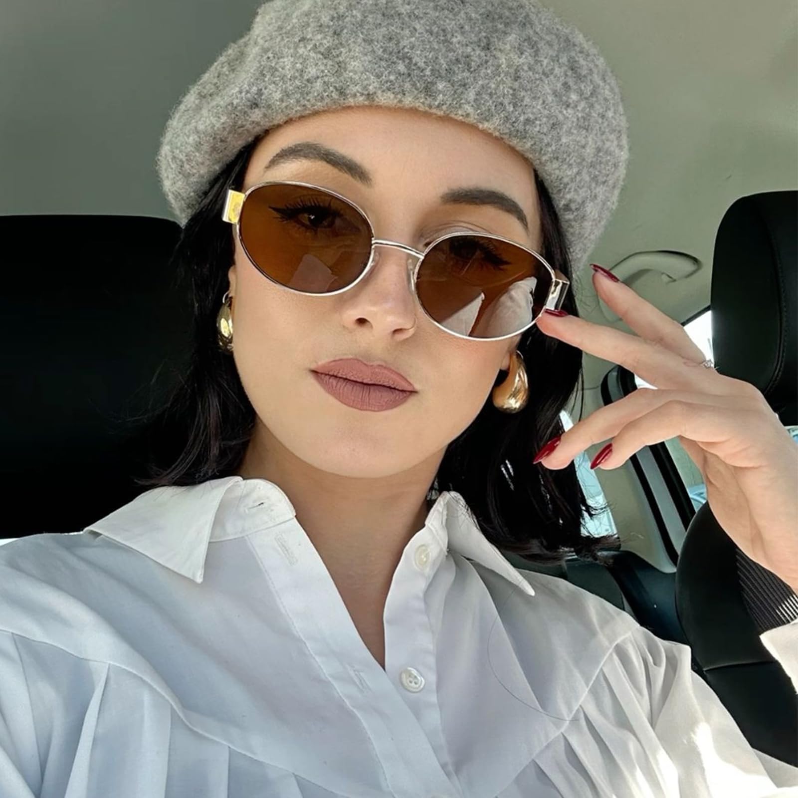 Women's brown oval sunglasses, stylish for sunny days