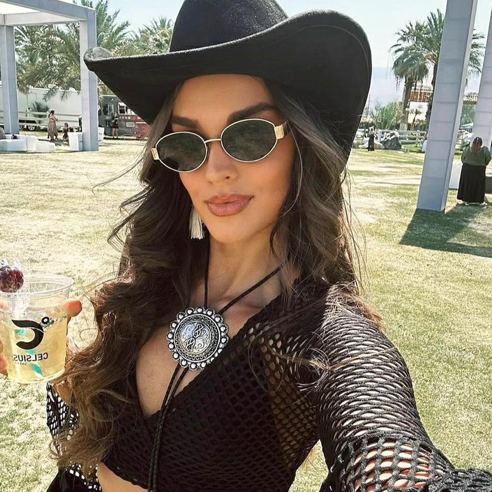 Women’s black oval sunglasses for sunny outdoor events