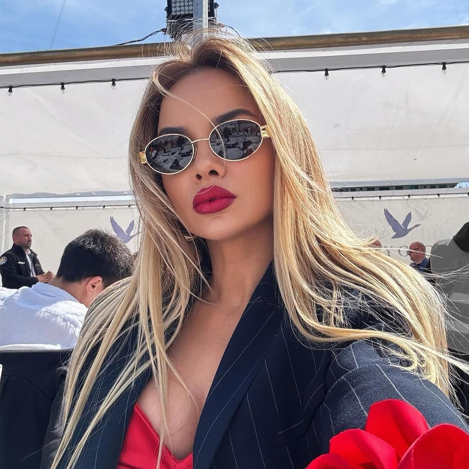 Women's trendy oval sunglasses with metallic frames for stylish outings
