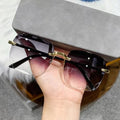 Black oversized sunglasses with gold detailing for stylish sun protection