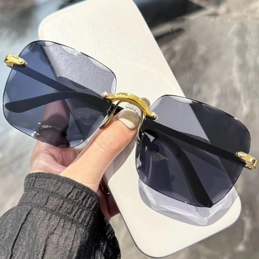 Oversized sunglasses with black lenses and gold accents, stylish accessory