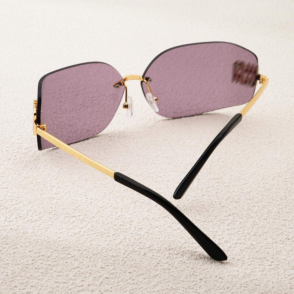 Oversized sunglasses with black and gold trim for stylish sun protection