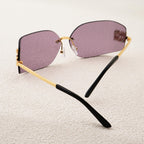 Oversized sunglasses with black and gold trim for stylish sun protection