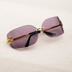 Oversized sunglasses with purple lenses and gold accents, trendy summer accessory
