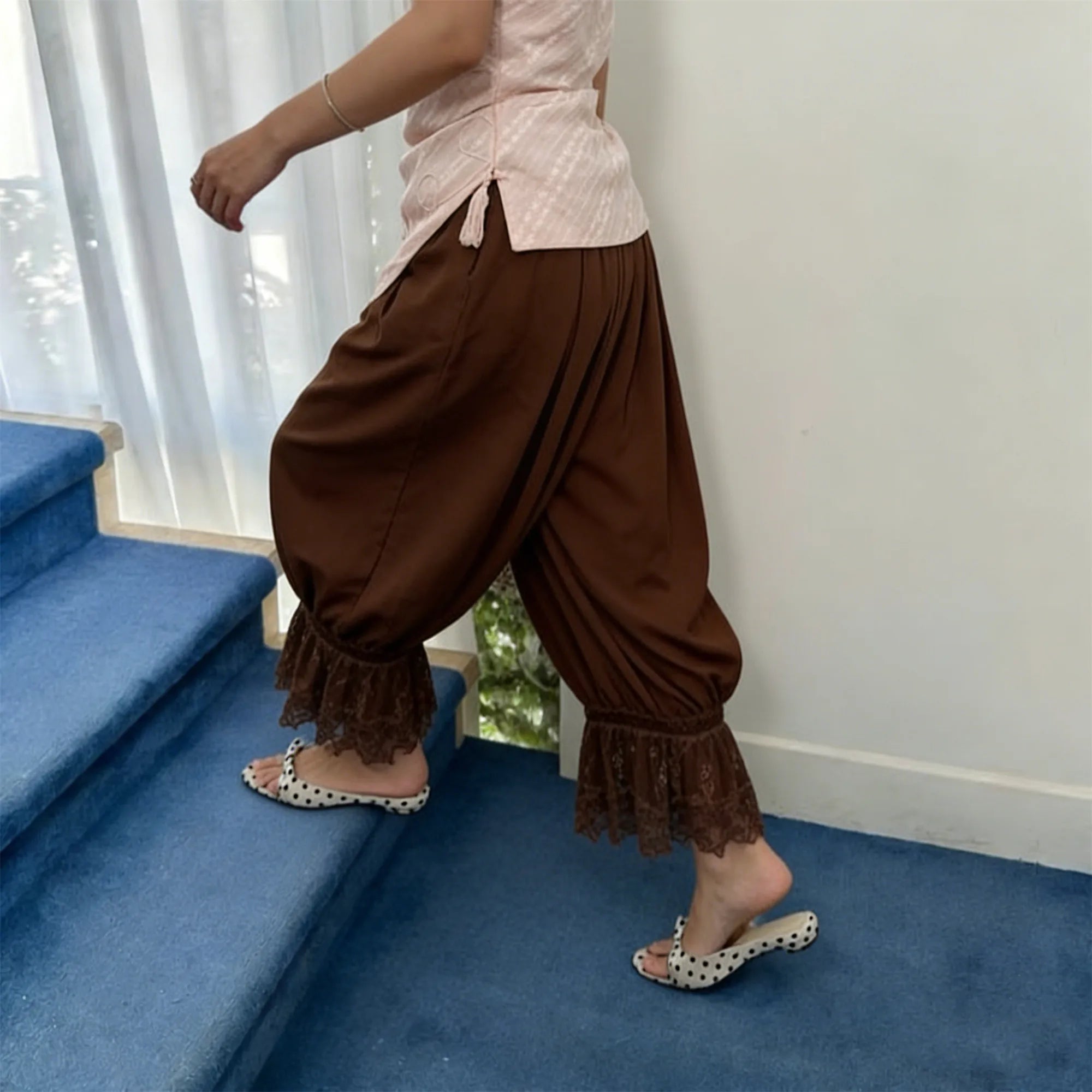 Brown pajama bottoms plaid with lace trim, perfect for lounging