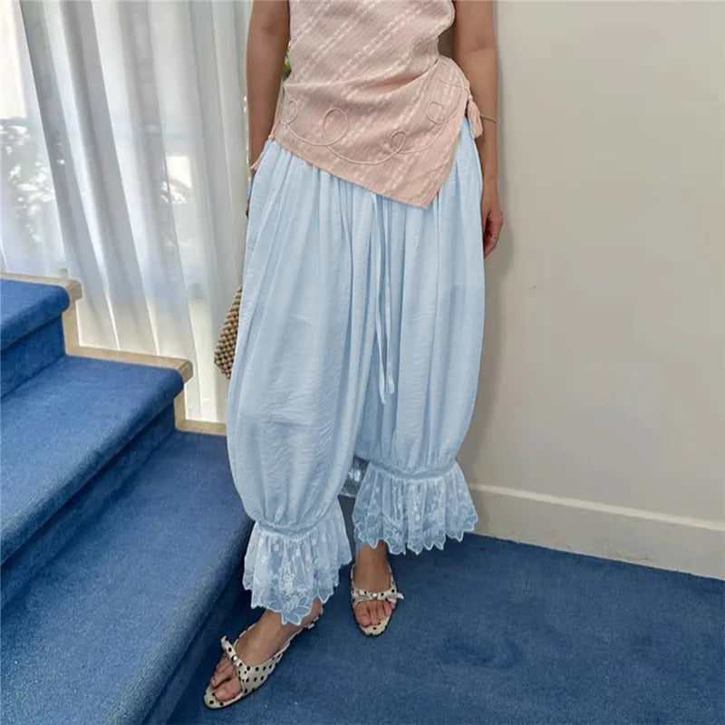 Light blue pajama bottoms plaid with lace trim for relaxed lounging