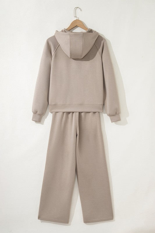 Women's JUNIPER BLVD pants and bra set in soft beige, perfect for workouts
