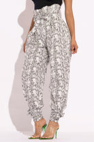 VacationGrabs paper bag waist pants for women with snake print and tapered ankle design