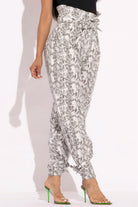 VacationGrabs paper bag waist pants for women in white snake print with high waist and tapered legs