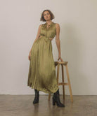 Chic Oasis Society Paris style boots for women paired with a flowing olive green maxi dress
