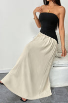 Elegant patchwork strapless tube dress in black and beige for a stylish summer look
