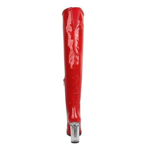 Red patent thigh high boots with a glossy finish and stylish high heel design