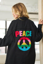 Davi & Dani women's peace symbol vacation shirt in black featuring colorful peace emblem on the back