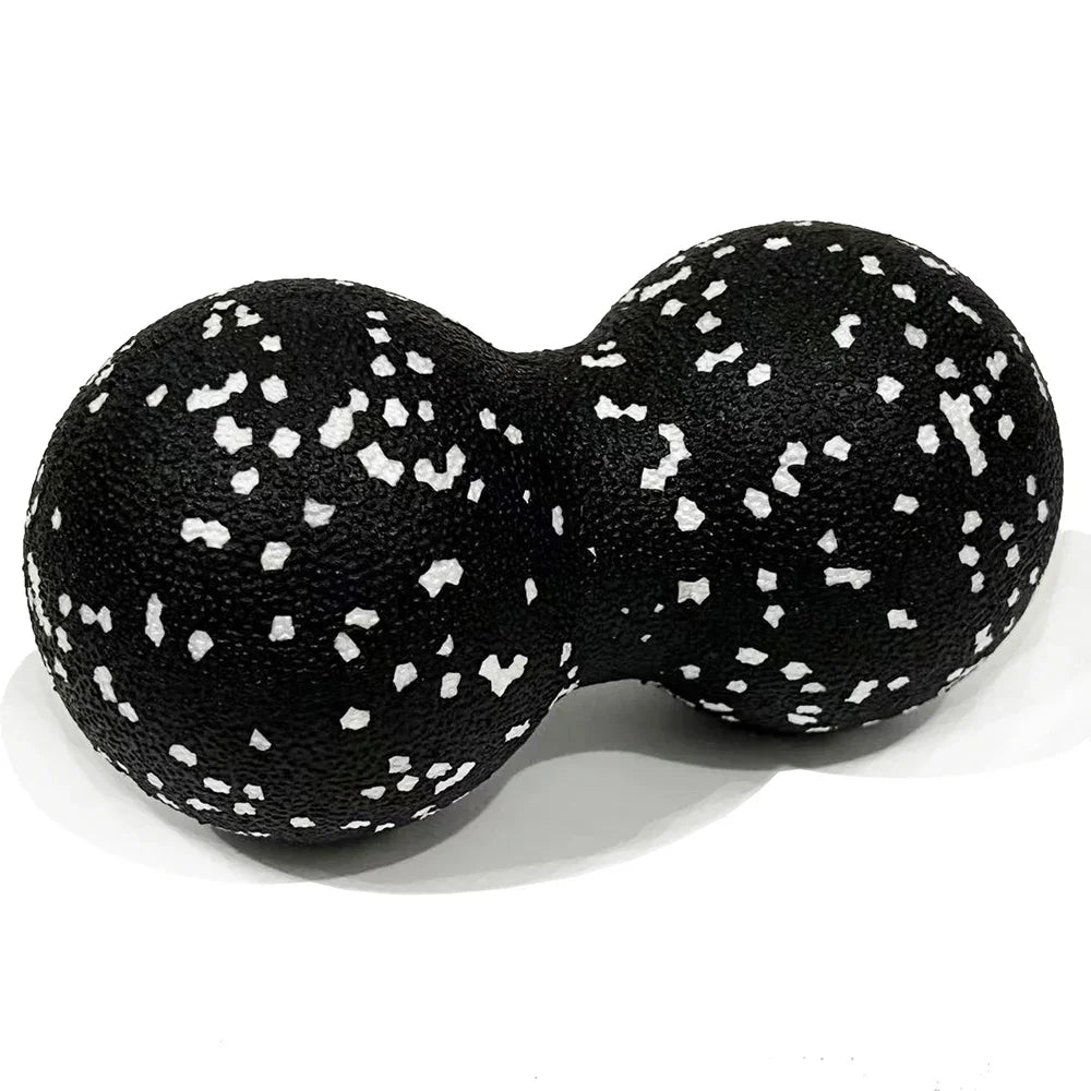 Black peanut massage ball for muscle relaxation, textured surface