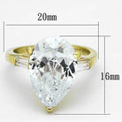 Stunning pear shaped gold engagement ring featuring a large clear stone and elegant detailing