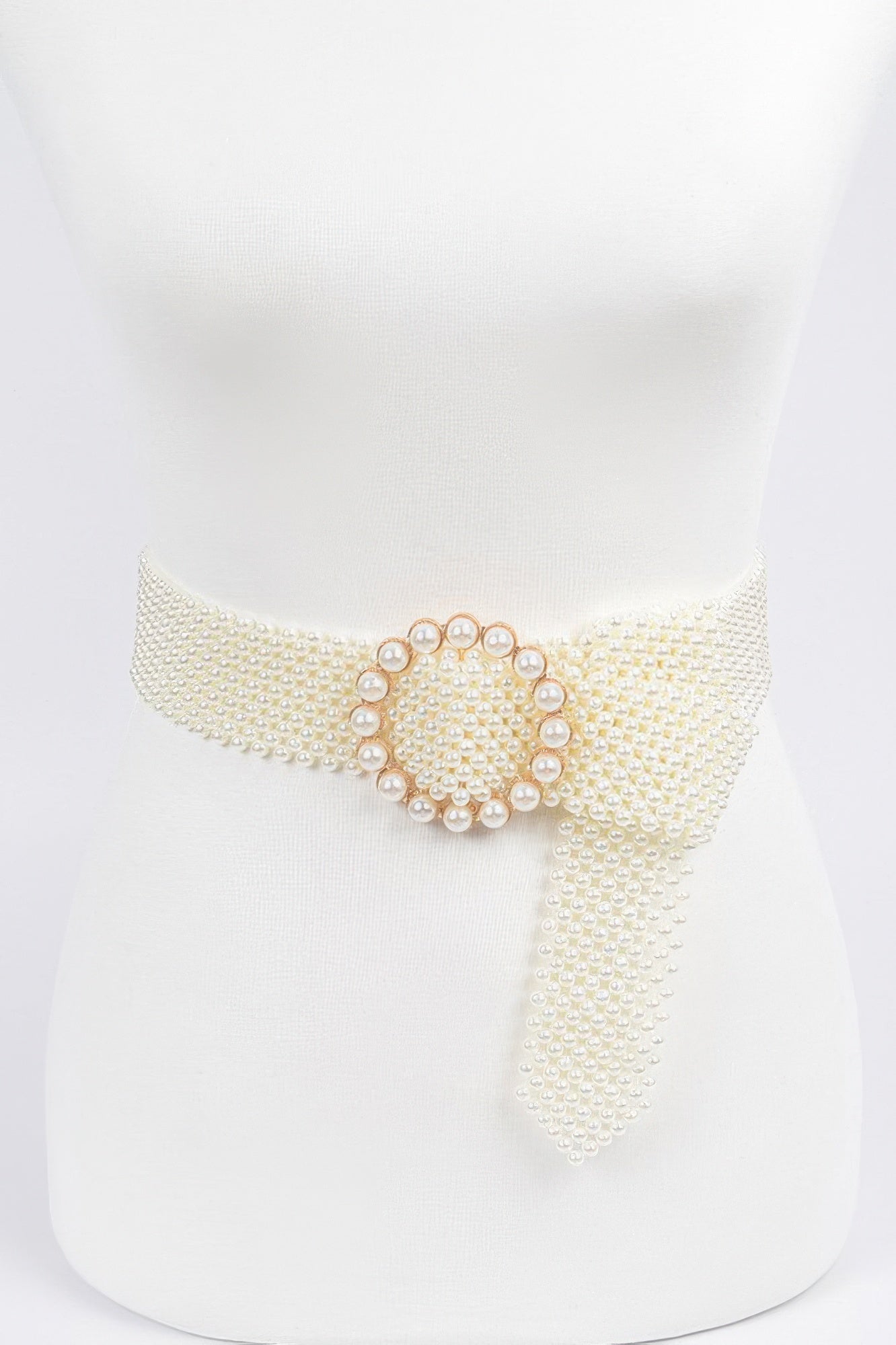 Elegant pearl beaded belt for women with a decorative round buckle in pearl accents