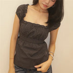 Women's black polka dot peplum top, perfect for casual outings